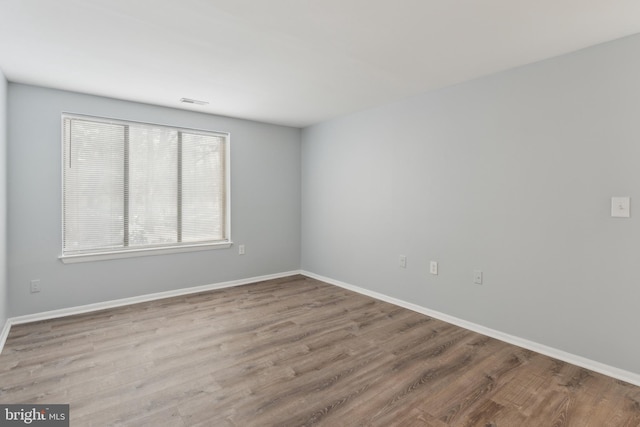 spare room with light wood-type flooring