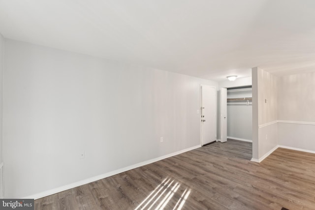 spare room featuring hardwood / wood-style flooring