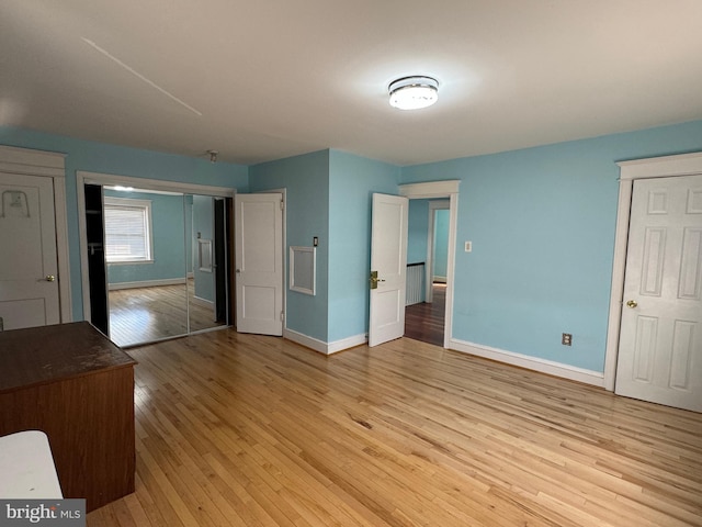 unfurnished bedroom featuring light wood-type flooring