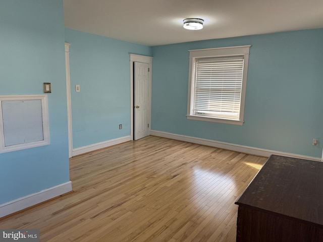 spare room featuring light wood-type flooring