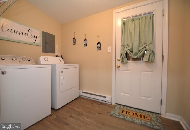 clothes washing area featuring washer and dryer, wood-type flooring, baseboard heating, and electric panel