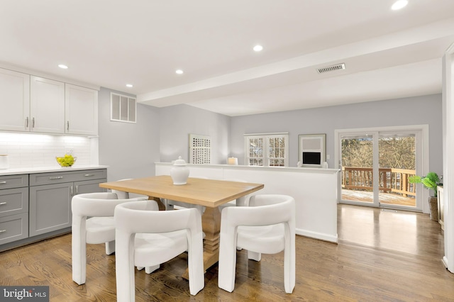 dining space with light hardwood / wood-style flooring