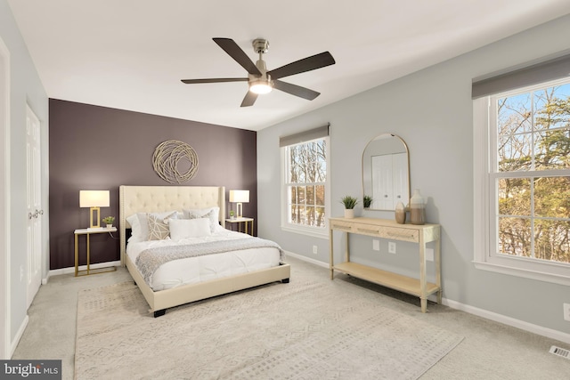 carpeted bedroom featuring ceiling fan