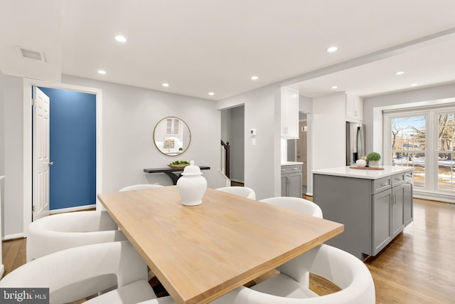 dining area with light hardwood / wood-style floors