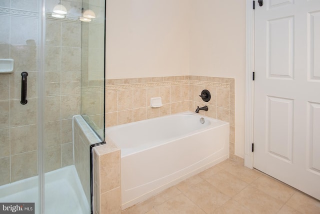 bathroom featuring tile patterned floors and plus walk in shower