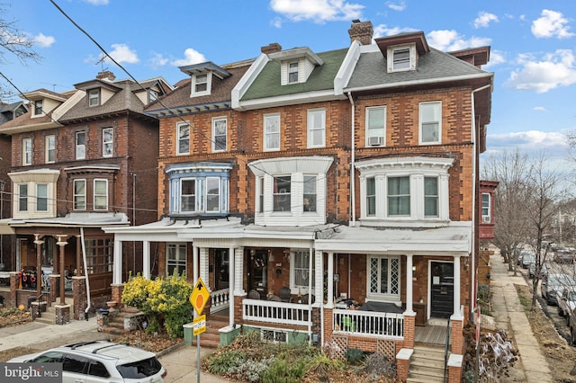 view of property featuring a porch