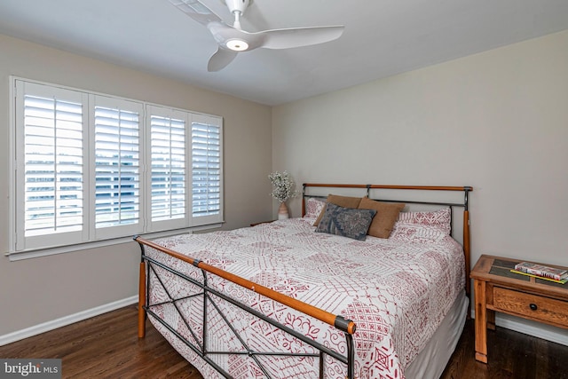 bedroom with ceiling fan and dark hardwood / wood-style floors