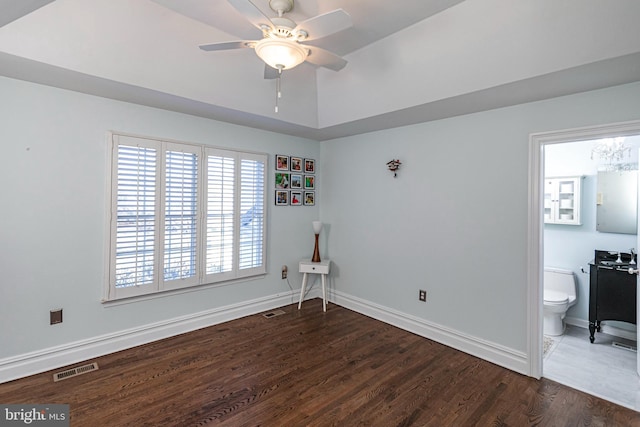 spare room featuring dark hardwood / wood-style floors and ceiling fan