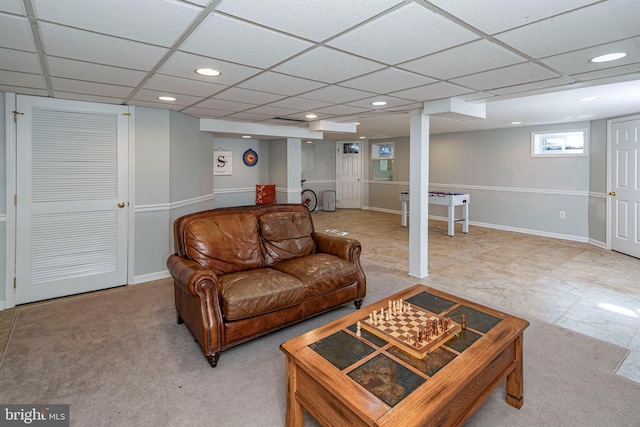 living room with a paneled ceiling