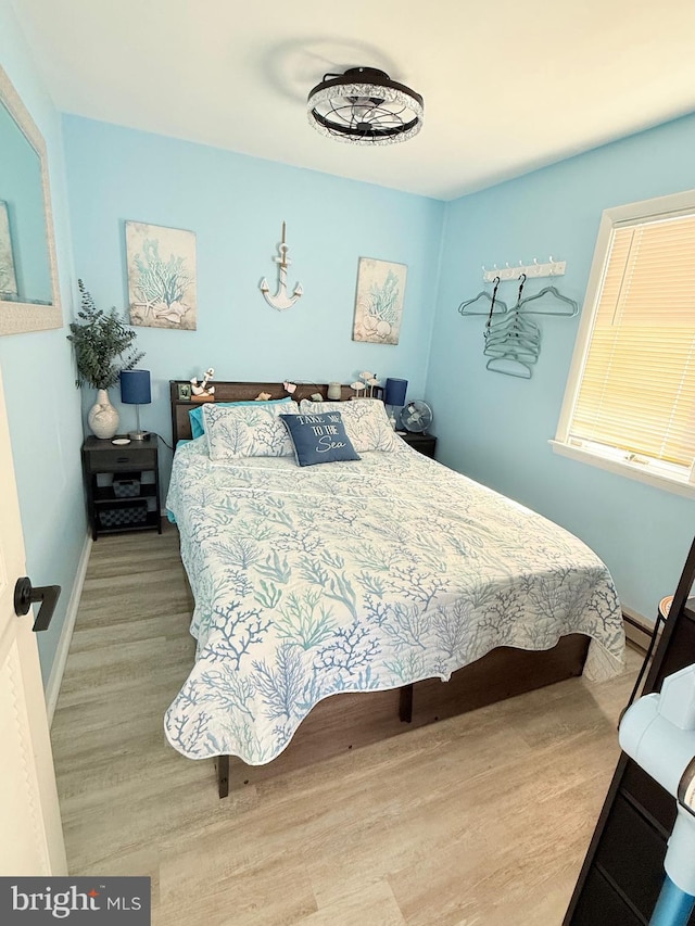 bedroom with light hardwood / wood-style floors