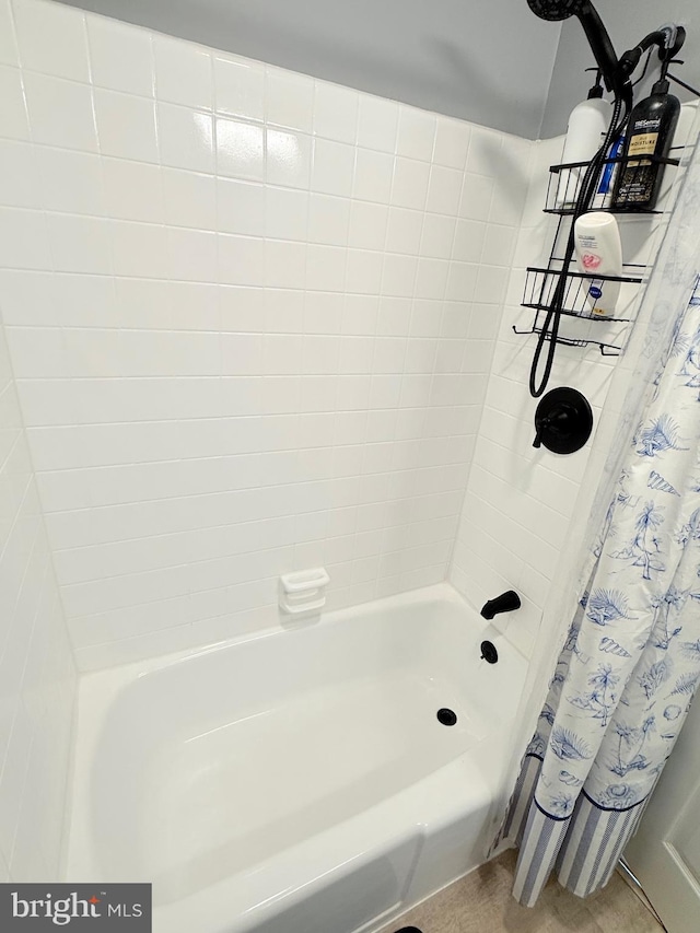 bathroom featuring shower / bath combo with shower curtain