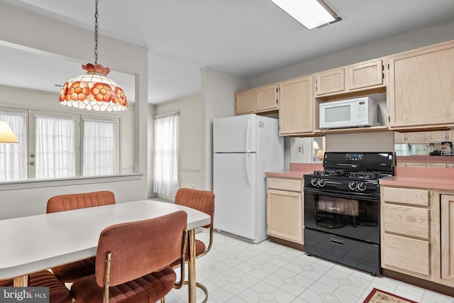 kitchen featuring pendant lighting, white appliances, and light brown cabinets