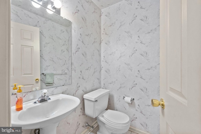 bathroom featuring sink and toilet