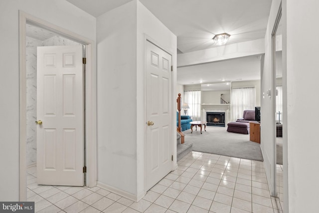 hallway featuring light carpet