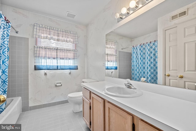 full bathroom featuring tile patterned floors, shower / tub combo with curtain, vanity, and toilet