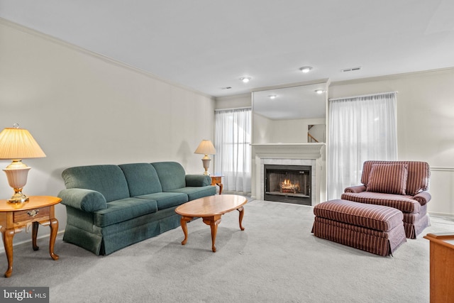 living room with carpet flooring and crown molding