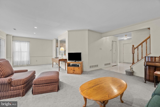 living room with light colored carpet and ornamental molding