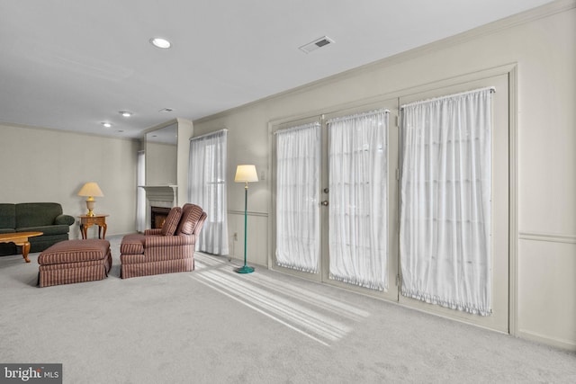 interior space featuring carpet flooring and ornamental molding