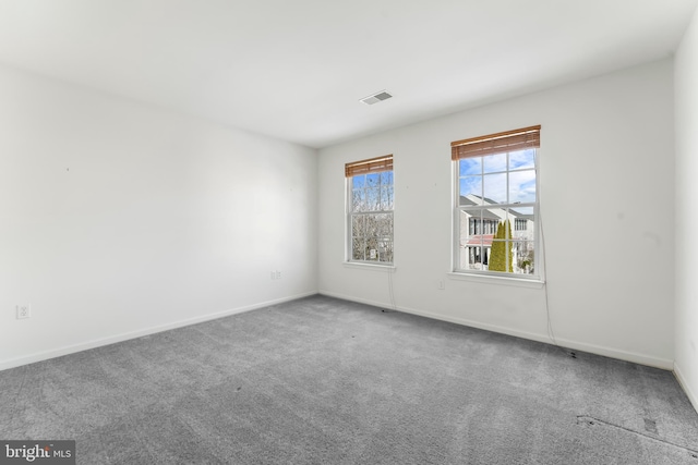 spare room featuring carpet flooring