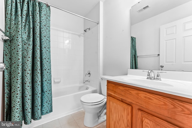 full bathroom with vanity, shower / tub combo with curtain, tile patterned floors, and toilet