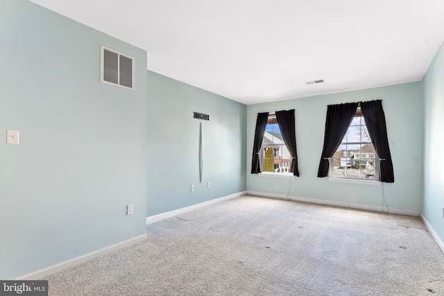 unfurnished room with carpet floors