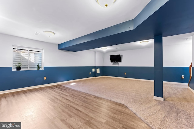 basement featuring hardwood / wood-style flooring