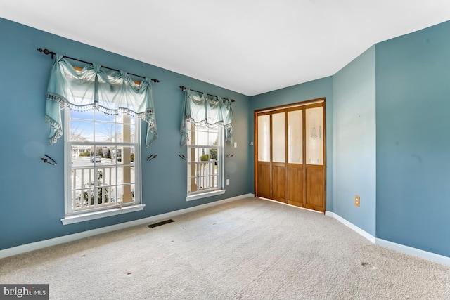 unfurnished room with carpet floors