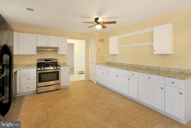 kitchen featuring white cabinetry, light stone counters, and stainless steel gas range