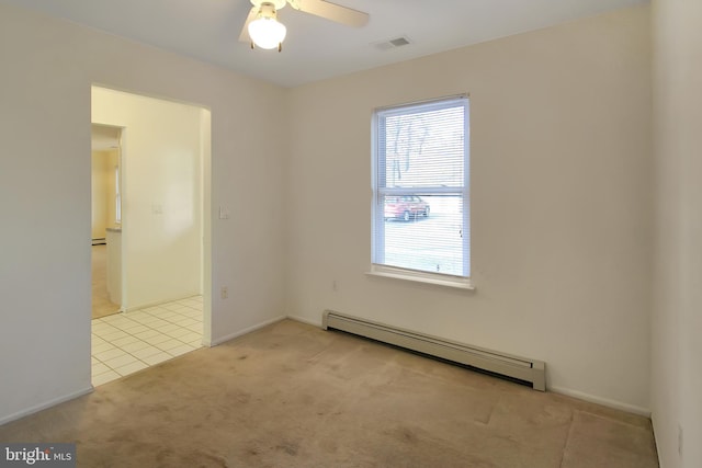 empty room featuring a baseboard radiator, ceiling fan, and light colored carpet