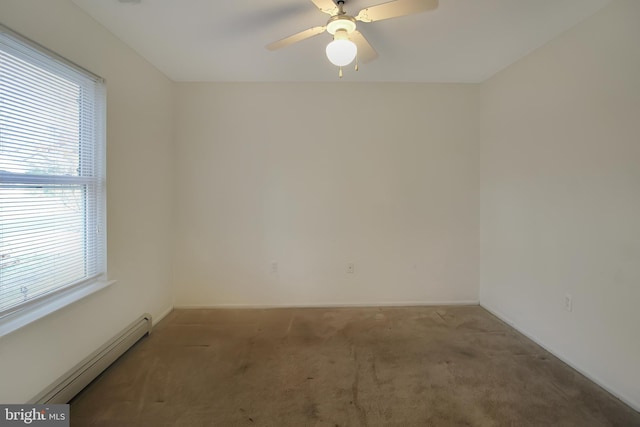 carpeted empty room with ceiling fan, a healthy amount of sunlight, and a baseboard heating unit