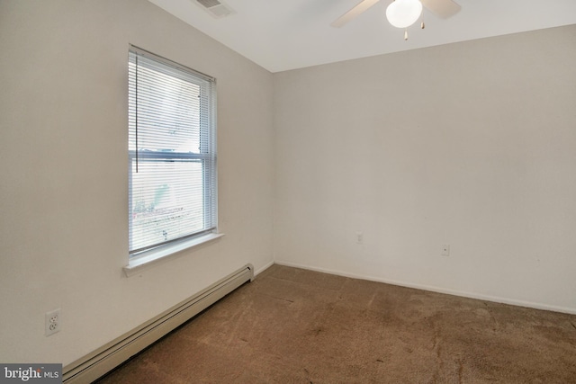 empty room with ceiling fan, plenty of natural light, dark carpet, and a baseboard heating unit