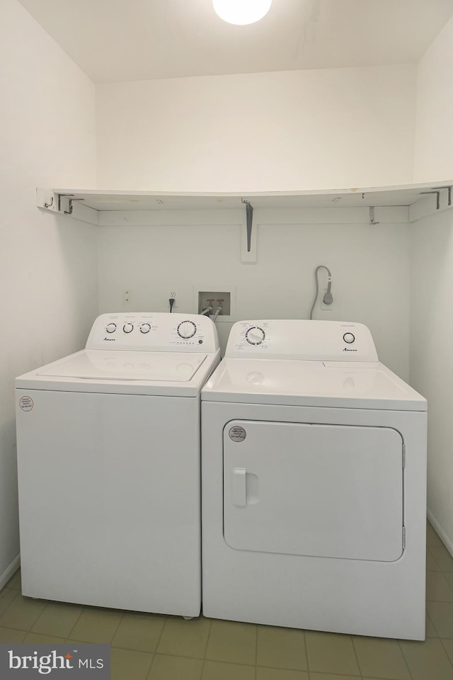 washroom with washer and dryer