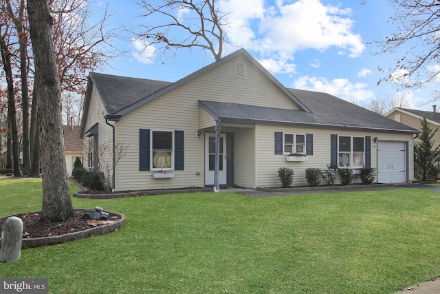 view of front facade featuring a garage and a front yard