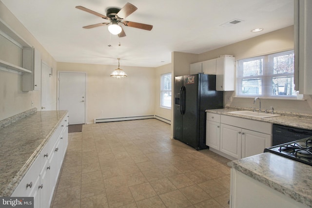 kitchen with black appliances, sink, decorative light fixtures, white cabinets, and plenty of natural light