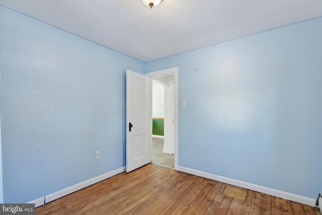 spare room featuring light hardwood / wood-style flooring