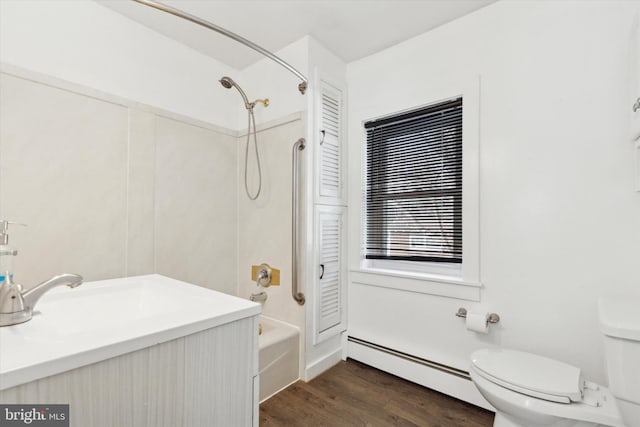 full bathroom with shower / bathing tub combination, vanity, a baseboard heating unit, toilet, and wood-type flooring