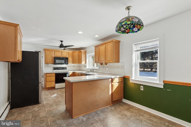 kitchen with pendant lighting, ceiling fan, white range with electric stovetop, kitchen peninsula, and stainless steel refrigerator