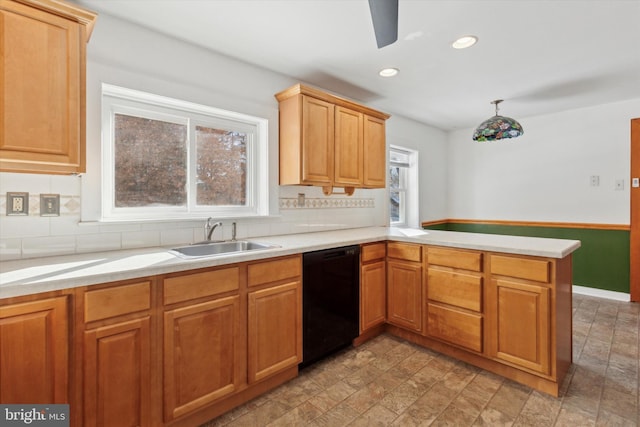 kitchen with kitchen peninsula, black dishwasher, backsplash, and sink