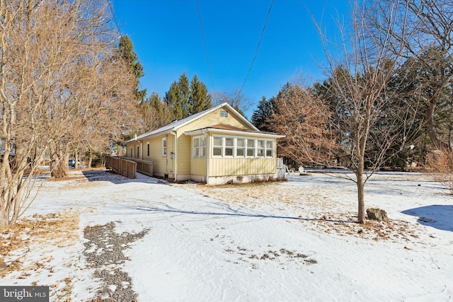 exterior space featuring a sunroom