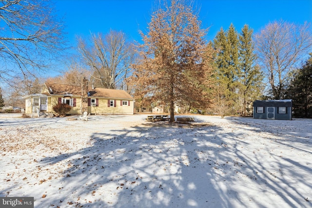 view of front of house with a shed