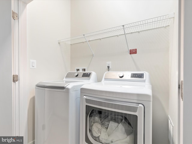 laundry area featuring independent washer and dryer