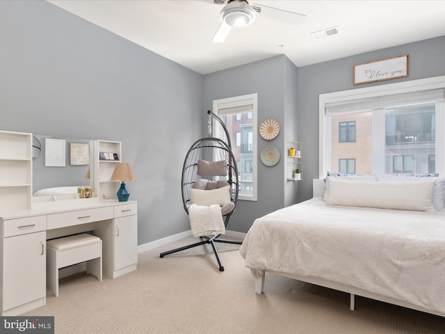 bedroom with light carpet and ceiling fan