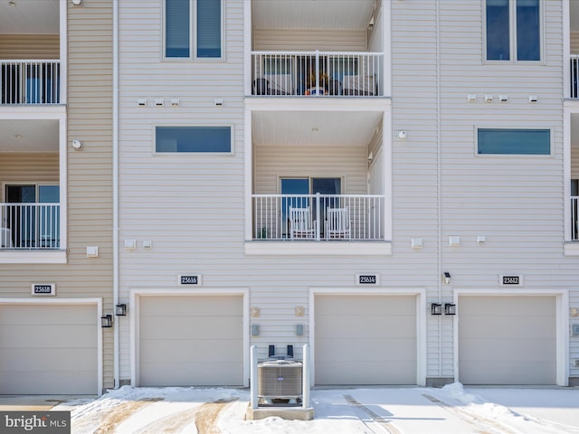 rear view of property featuring central AC unit