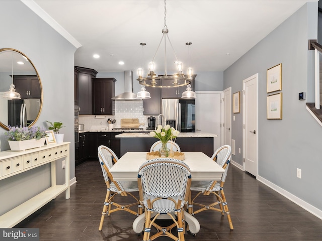 dining room featuring dark hardwood / wood-style flooring and a notable chandelier