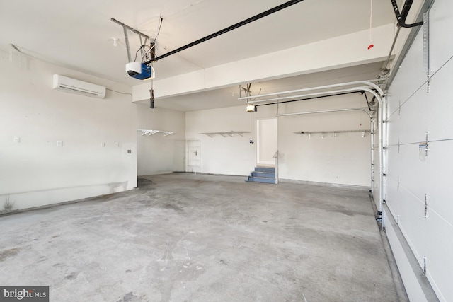 garage with a garage door opener and a wall unit AC