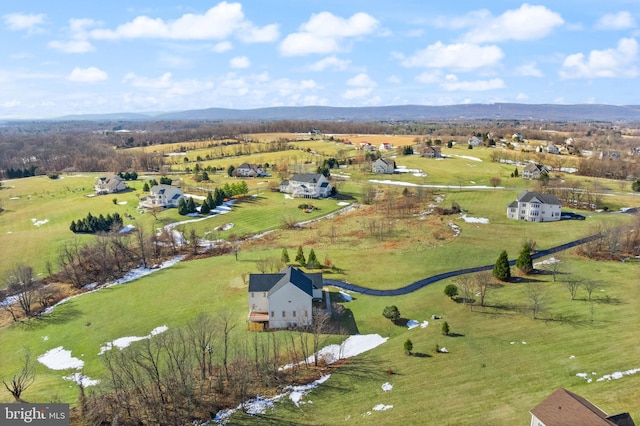 birds eye view of property featuring a mountain view and a rural view