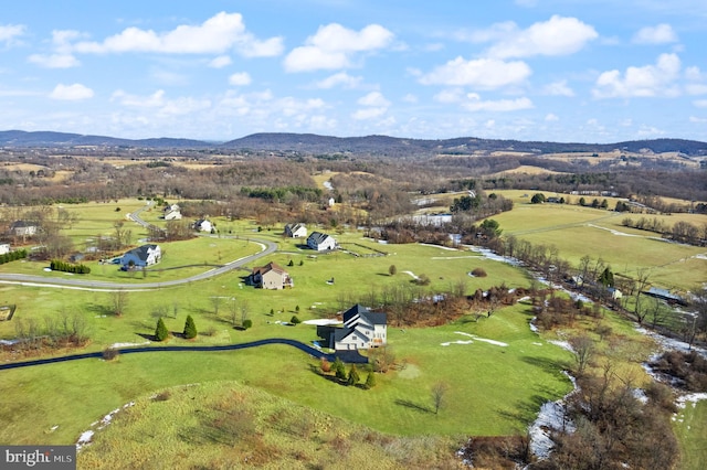 birds eye view of property featuring a mountain view and a rural view