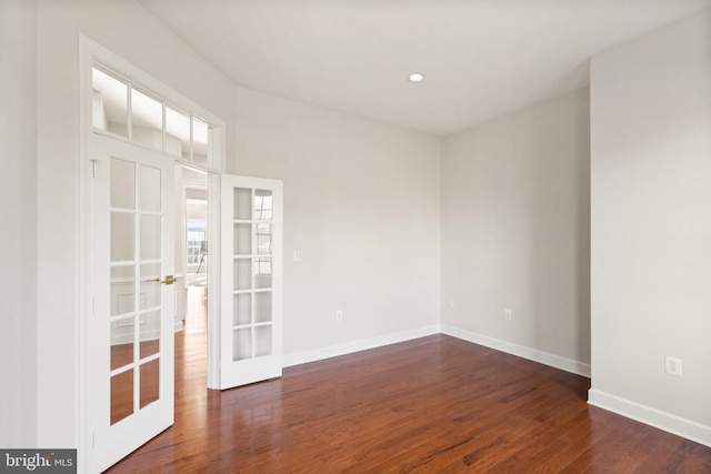 unfurnished room featuring dark wood-type flooring and french doors