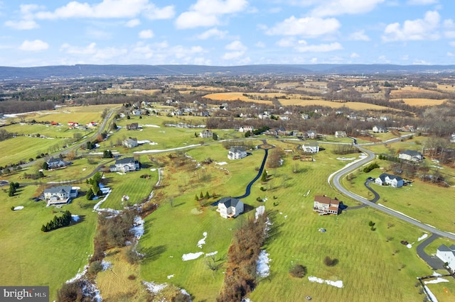 birds eye view of property with a rural view