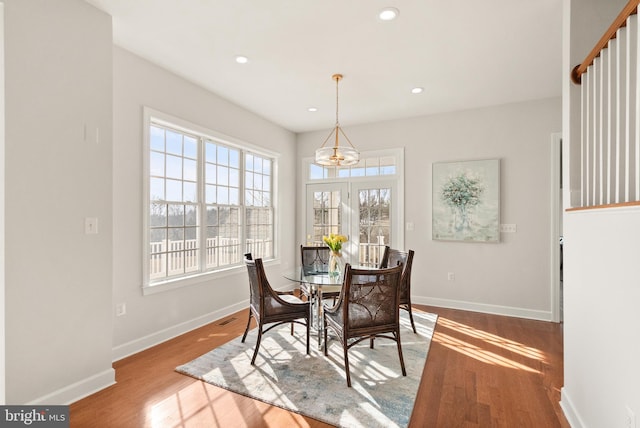 dining space featuring light wood-type flooring